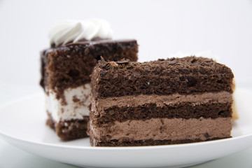 Two chocolate cakes on white background