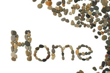 The word home written using volcanic stones from the black sea