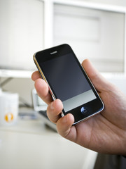 hand holding mobile communication device
