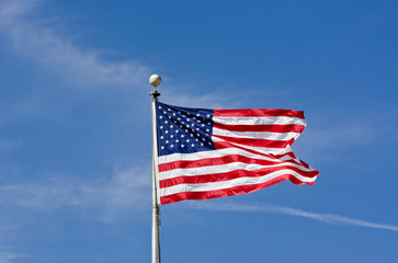 American Flag Blowing Blue Sky