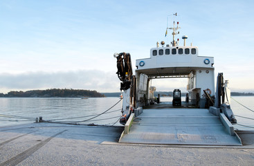 Small ferryboat moored at quay