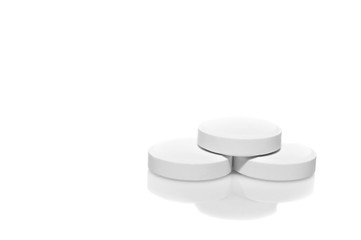 white pills on white background, macro