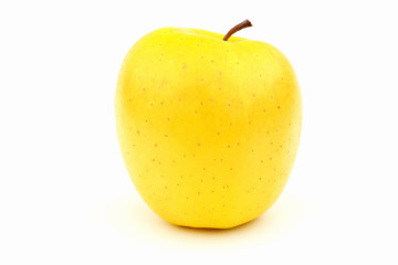 Yellow tasty apple on a white background