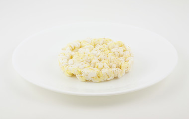 White dish with a low calorie rice cake.