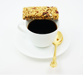 Energy bar with coffee for a quick break from work.