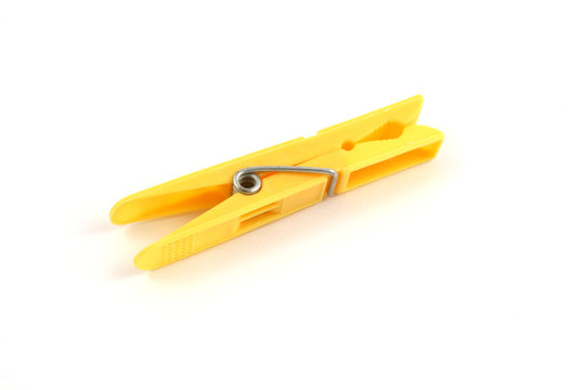 yellow plastic clothes peg