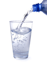 Water poured from the bottle to the glass