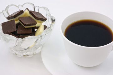 Coffee and sweet white and dark chocolate for a morning break.