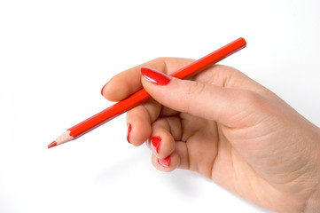 Red pencil in woman hand