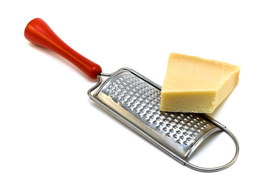 Parmesan cheese with grater on a white background