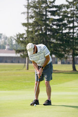 Obraz premium Man Playing Golf