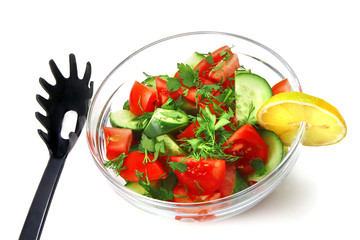 raw vegetable salad in bowl over white