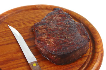 grilled beef with knife