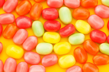Various dry colourful sweets arranged as background