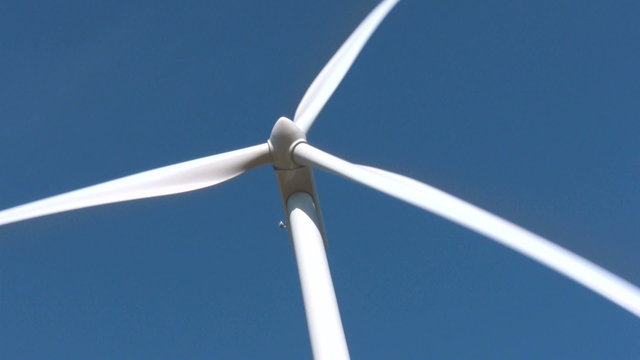 Wind mill on blue sky during the autumn