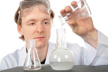 Chemist pours  liquid in flask