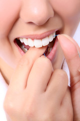Woman Flossing Her Teeth