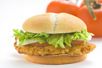 crisp chicken burger with tomato onion cheese lettuce