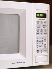 White Microwave oven partial view