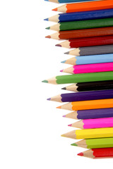 Colored pencils on white background