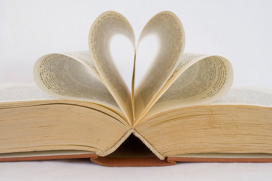 sheets of a book curved into heart shapes