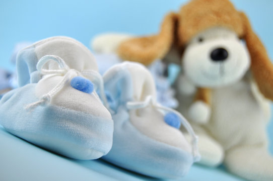 Blue Baby Sleepers And Toy Dog