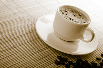 cup of coffee and coffee beans