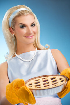 Beautiful woman holding hot italian pie. Retro stylized portrait
