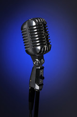 Vintage Microphone Over Blue background