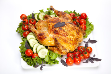 Whole roasted chicken on white
