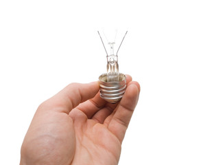 Hand holding broken bulb isolated on white