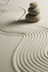 Stack of stones on raked sand - 11954181