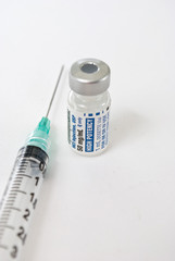 Hypodermic needle and vial of medicine