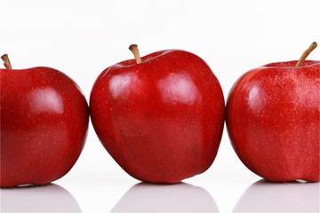 Three shiny red apples