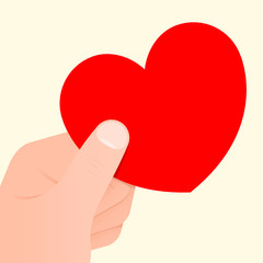 Hand holding a red heart