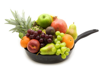 fresh fruits in the pan on white background