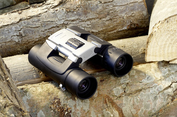 Sport Binocular on pile of wood