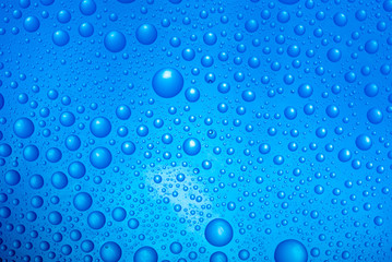 water drops over blue background