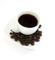 White coffee cup with coffee beans
