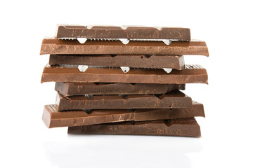 Broken milk and dark chocolate bar isolated on white background