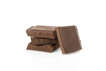 Dark chocolate bar broken into squares isolated on white