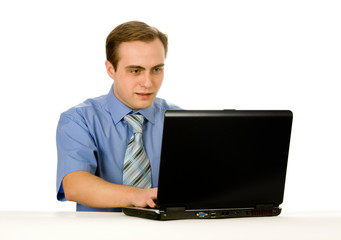 Fototapeta na wymiar Young businessman working on a laptop. Isolated on white.