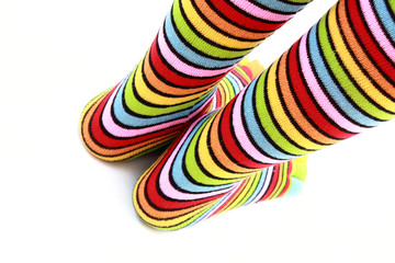 Obraz premium woman legs in strip sock on white background