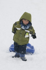 Fototapeta na wymiar boy pulling a sled
