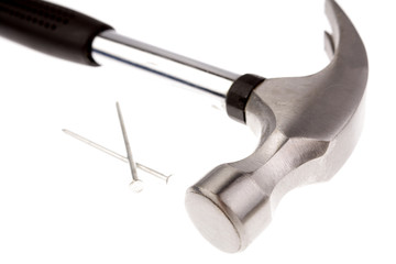 Hammer and nails on white