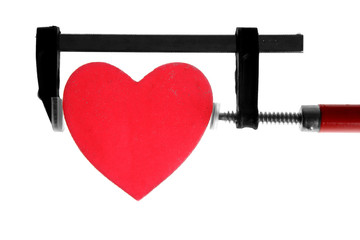 clamp grip tool pressing red heart