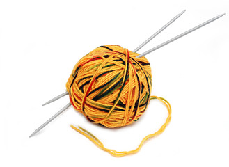 yellow wool ball with needles