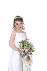 Fototapeta na wymiar pretty girl in white gown and holding bouquet of flowers