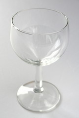 An empty wine glass, isolated on white background