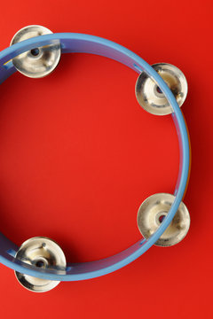 Tambourine on red backgroud